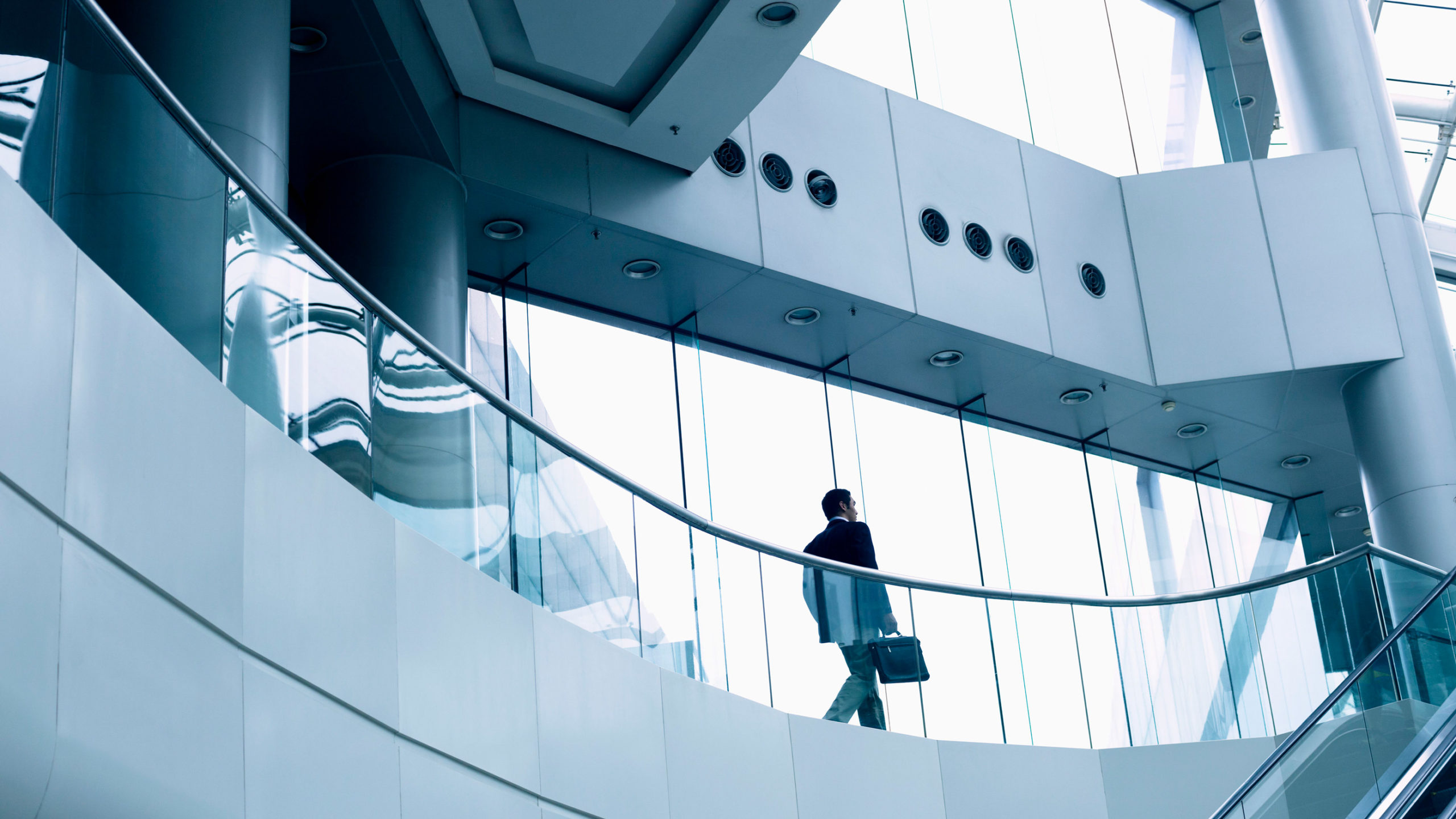 Corporate man walking with a briefcase